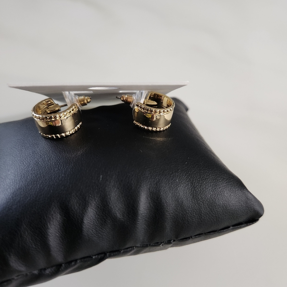 Express Gold Tone Small Huggie Earrings with Etching on sides.